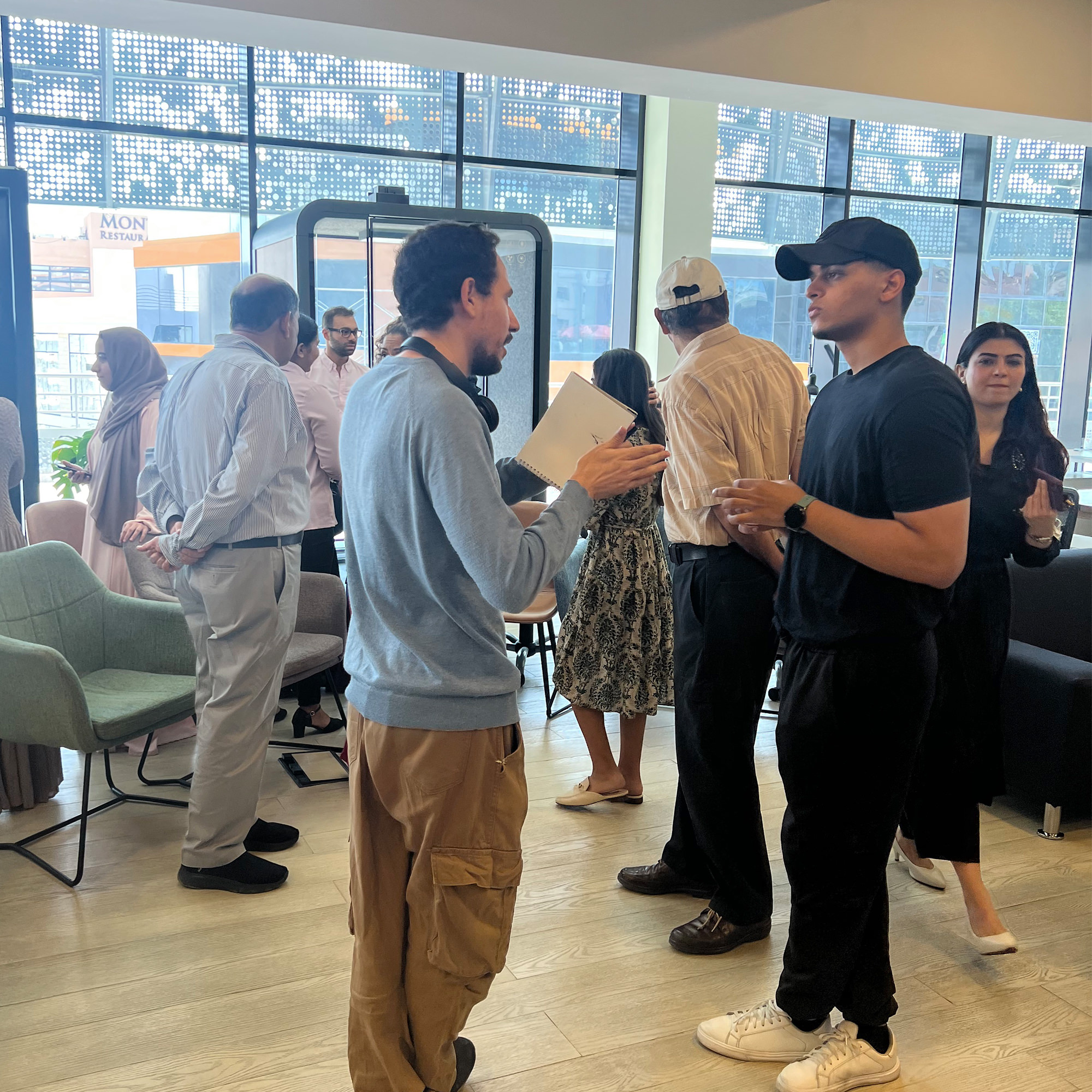 Several individuals are gathered in a lobby area