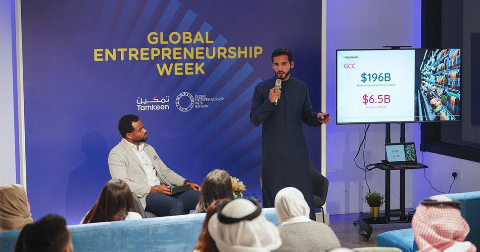 A man is giving a presentation at the Global Entrepreneurship Week