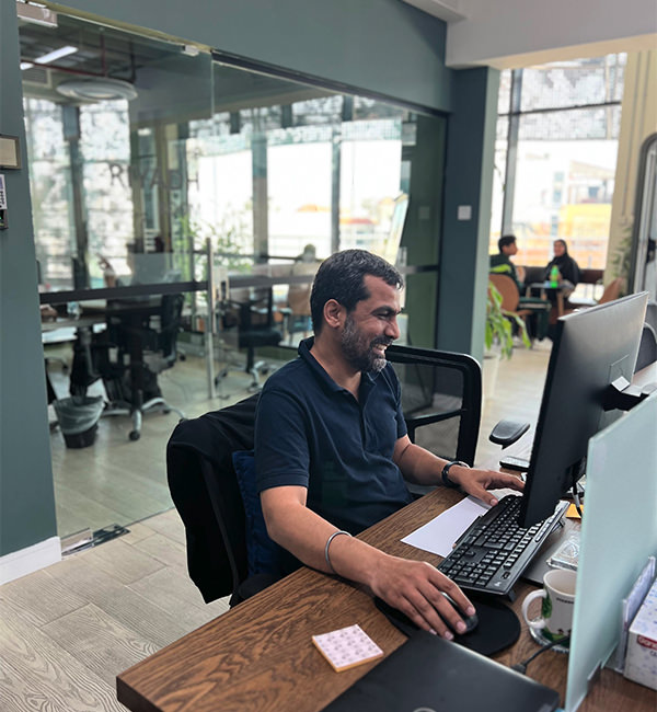 A man is working on a computer